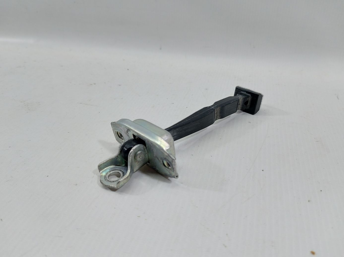 Versa note. Обмежувач двері передньої лівої Nissan Versa Note 2014-2019 804303VA0B Nissan Versa Note